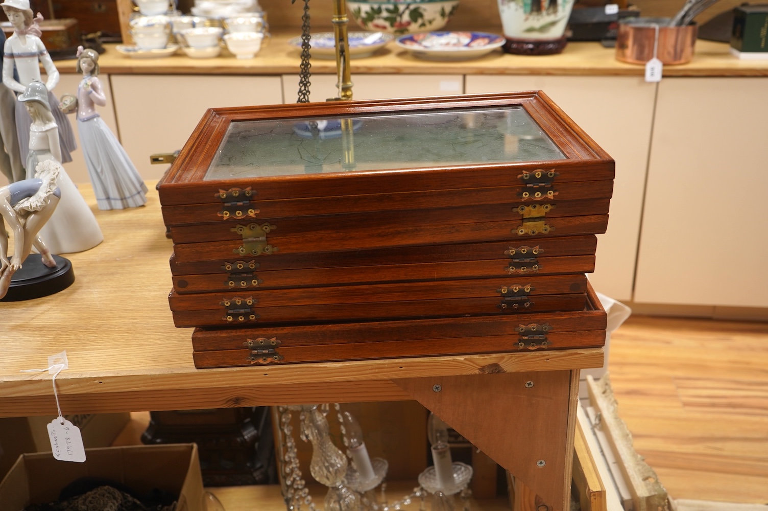 A collection of five small portable wooden and glass jewellery display cases. 4cm high x 40.5cm wide x 28cm deep. Condition - good